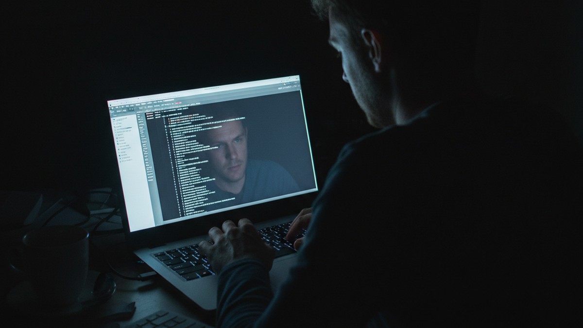 Person checking DNS cache on laptop at night to investigate deleted browser history